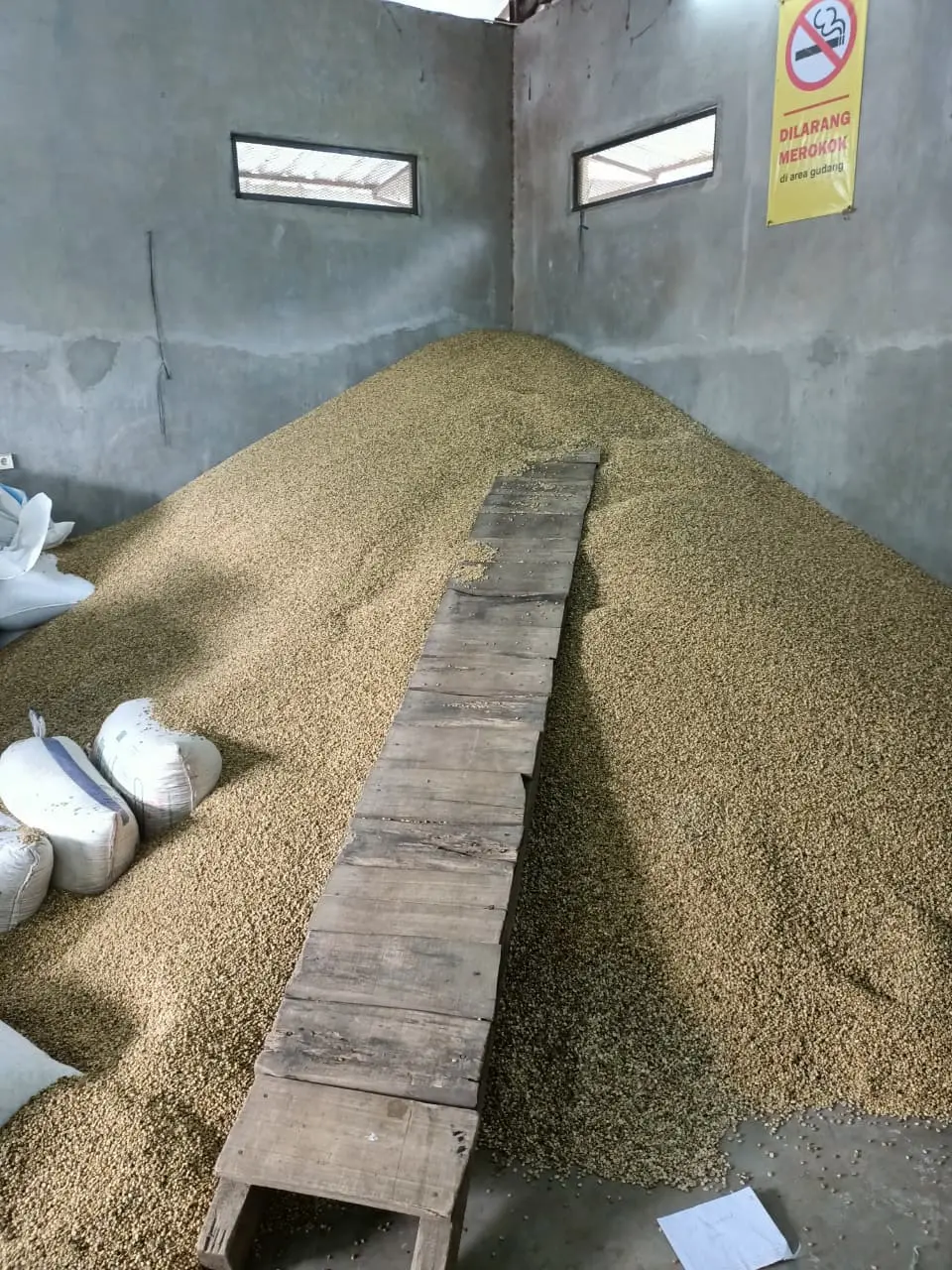 Coffee bags being loaded for international export by Wira Sarwa Asurya